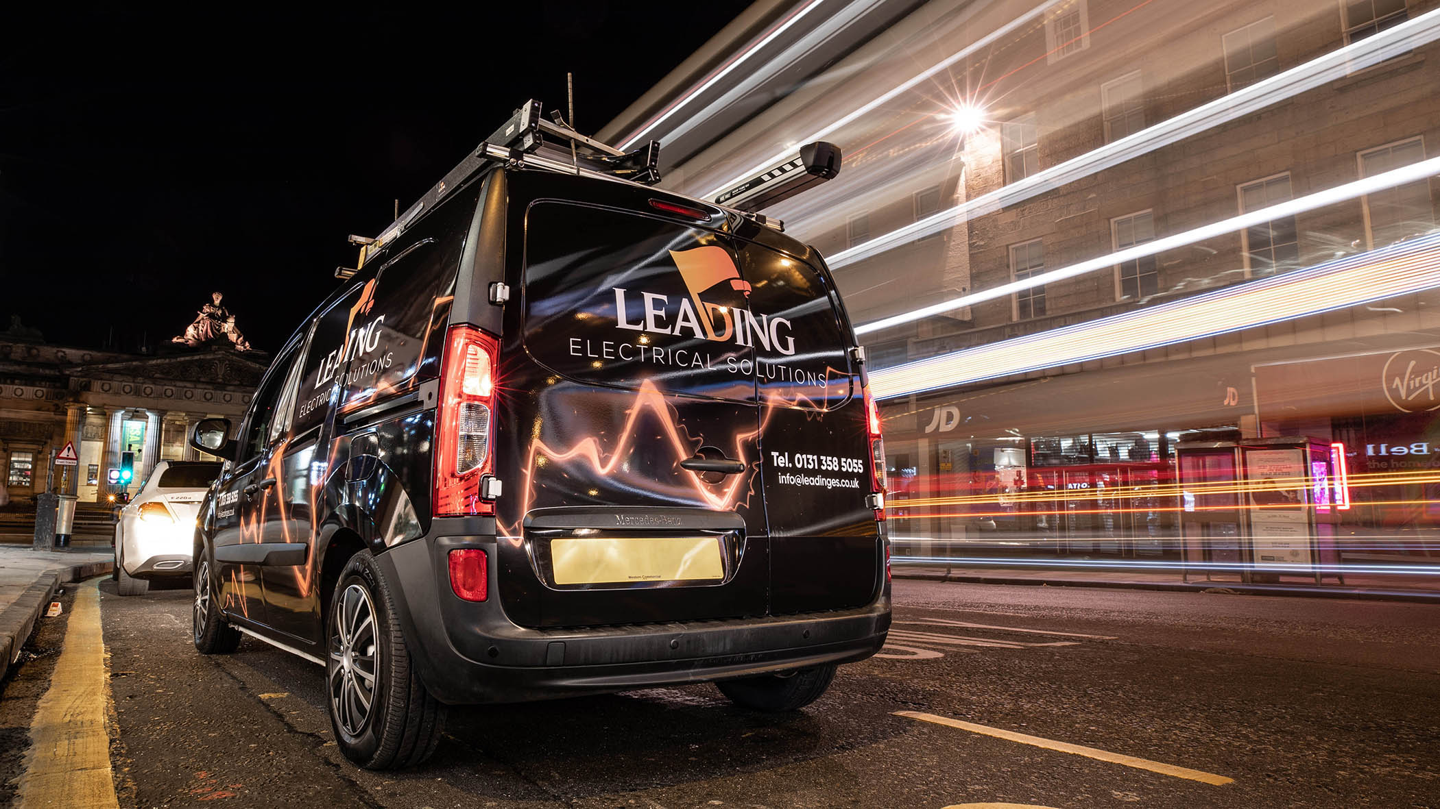 A stylish photo of Leading Electrical Solutions van in Edinburgh City Centre ready to start a job